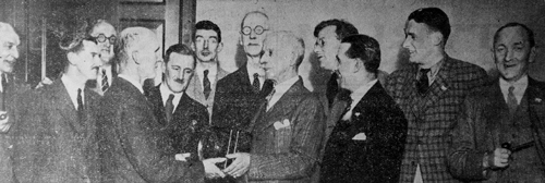 Major J.F.Duncan, the president, presented a clock to former professional Harry Bolton in February 1935. From left: H.B.Morton, G.D.Morrison, J.Y.D.Bruce, Harry Bolton, G.Mailer, R.W.D.Morrison, W.Shearer, Major Duncan, N.R.P.Bruce, J.A.Macfarlane, W.L.McCulloch, J.Bruce.